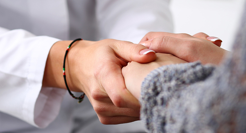 Doctor comforting patient with deeper patient insights